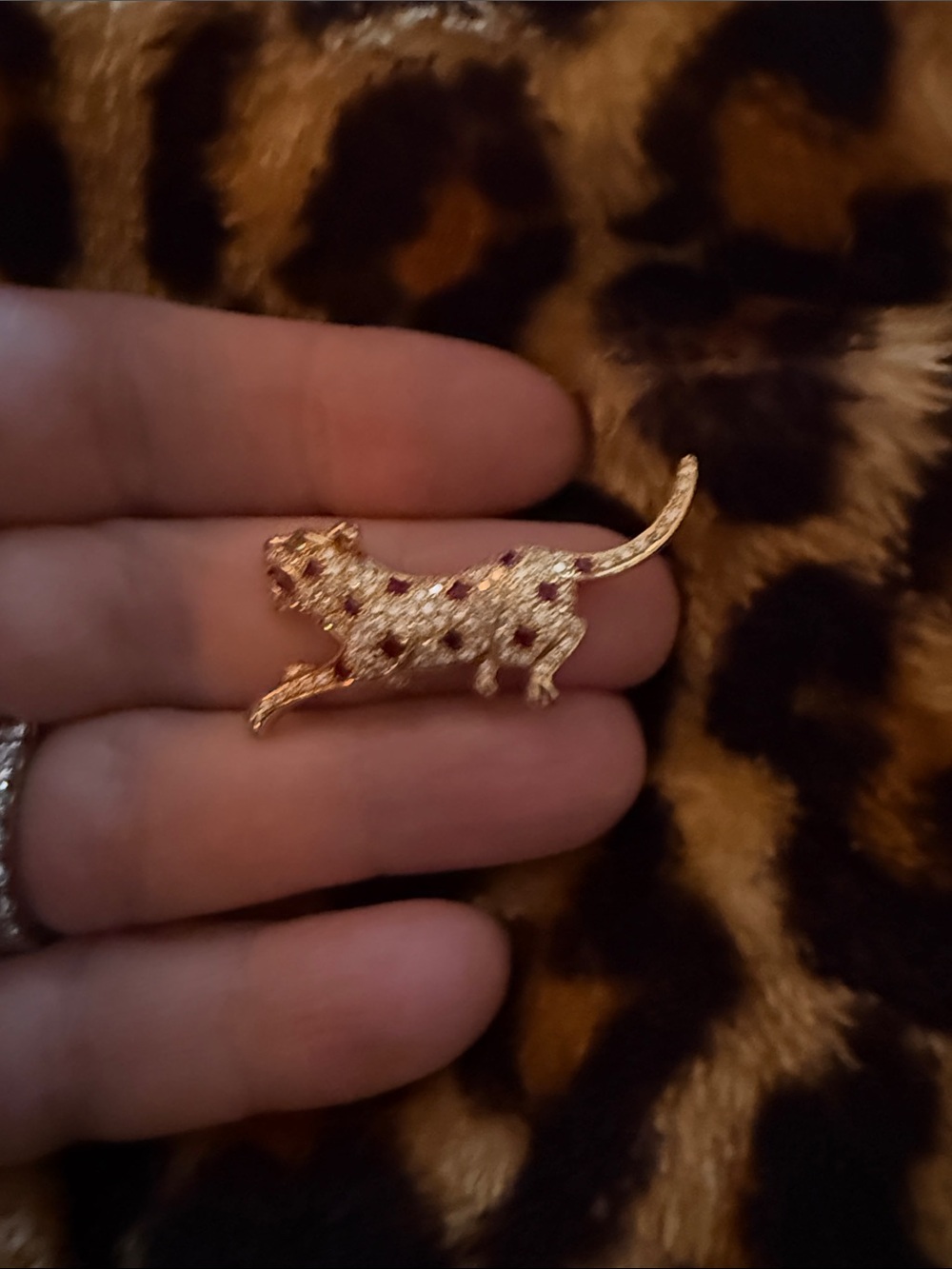 18 kt yellow gold ruby and diamond leopard brooch.
